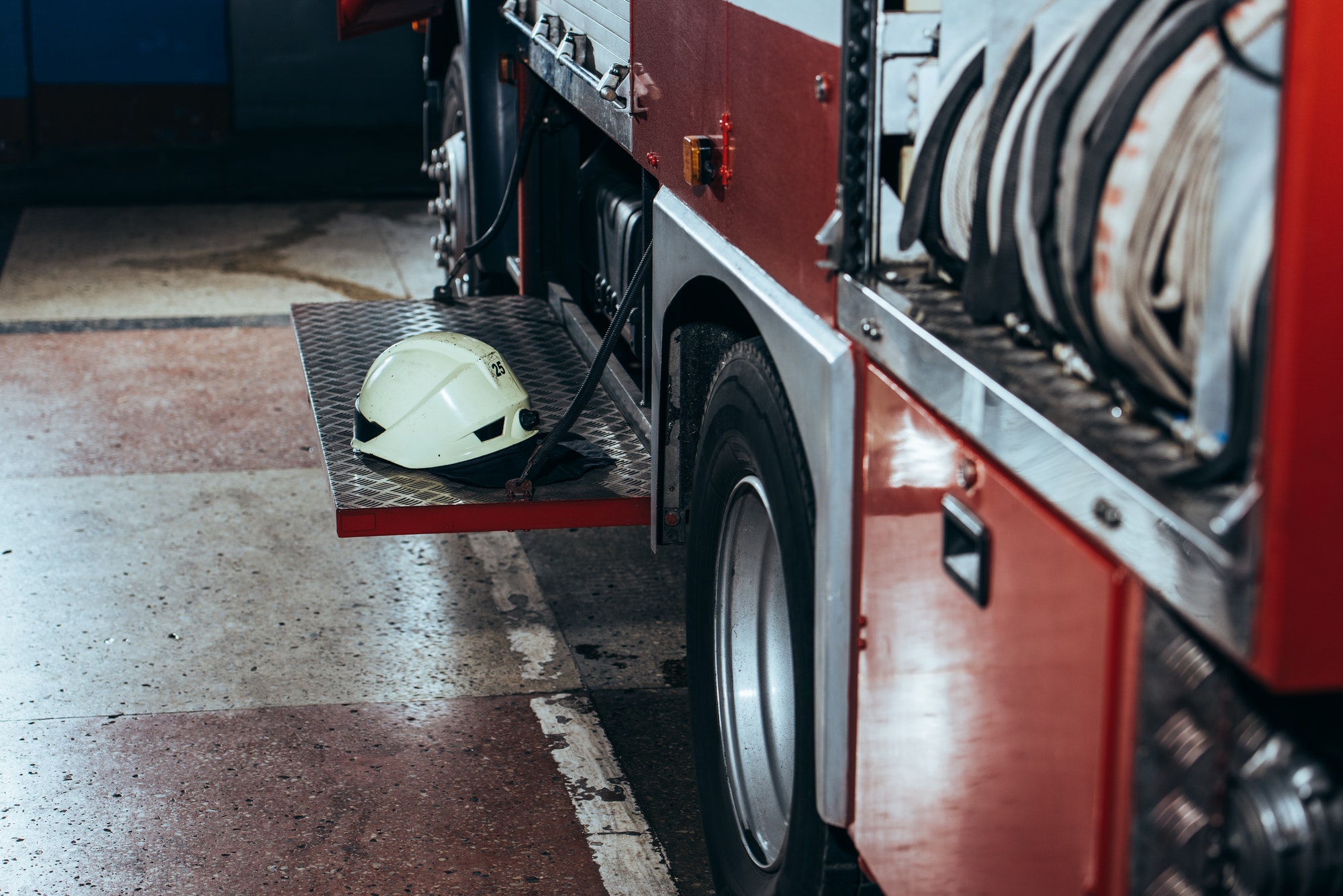 close up view of protective helmet on fire truck at fire station